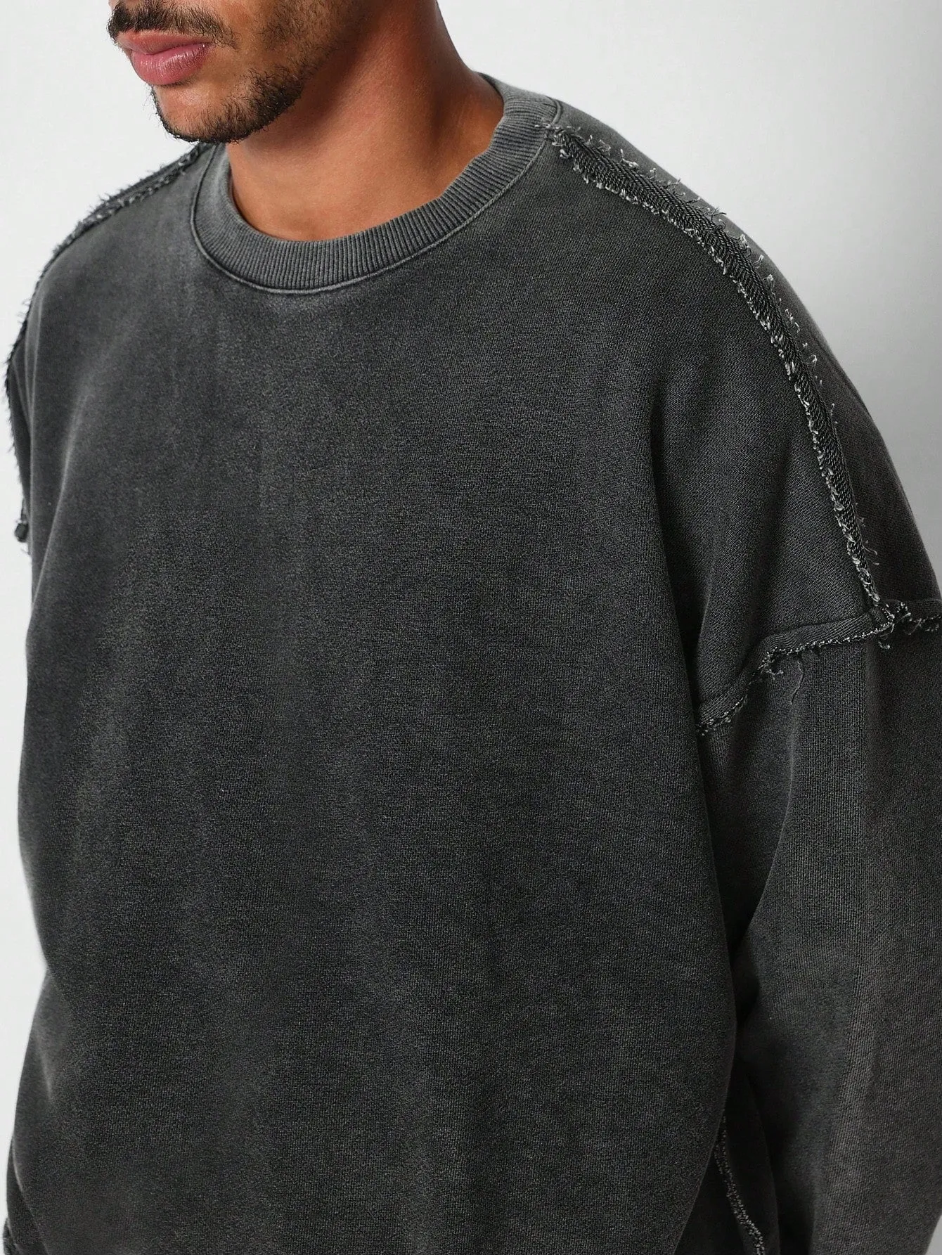 Oversized Fit Crew Neck Sweatshirt With Raw Seam Detail