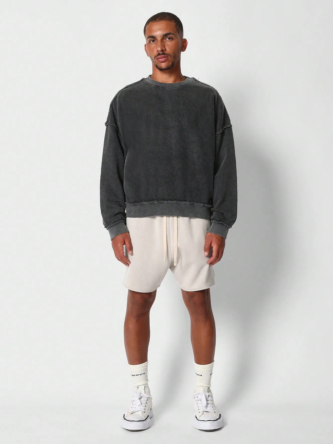 Oversized Fit Crew Neck Sweatshirt With Raw Seam Detail
