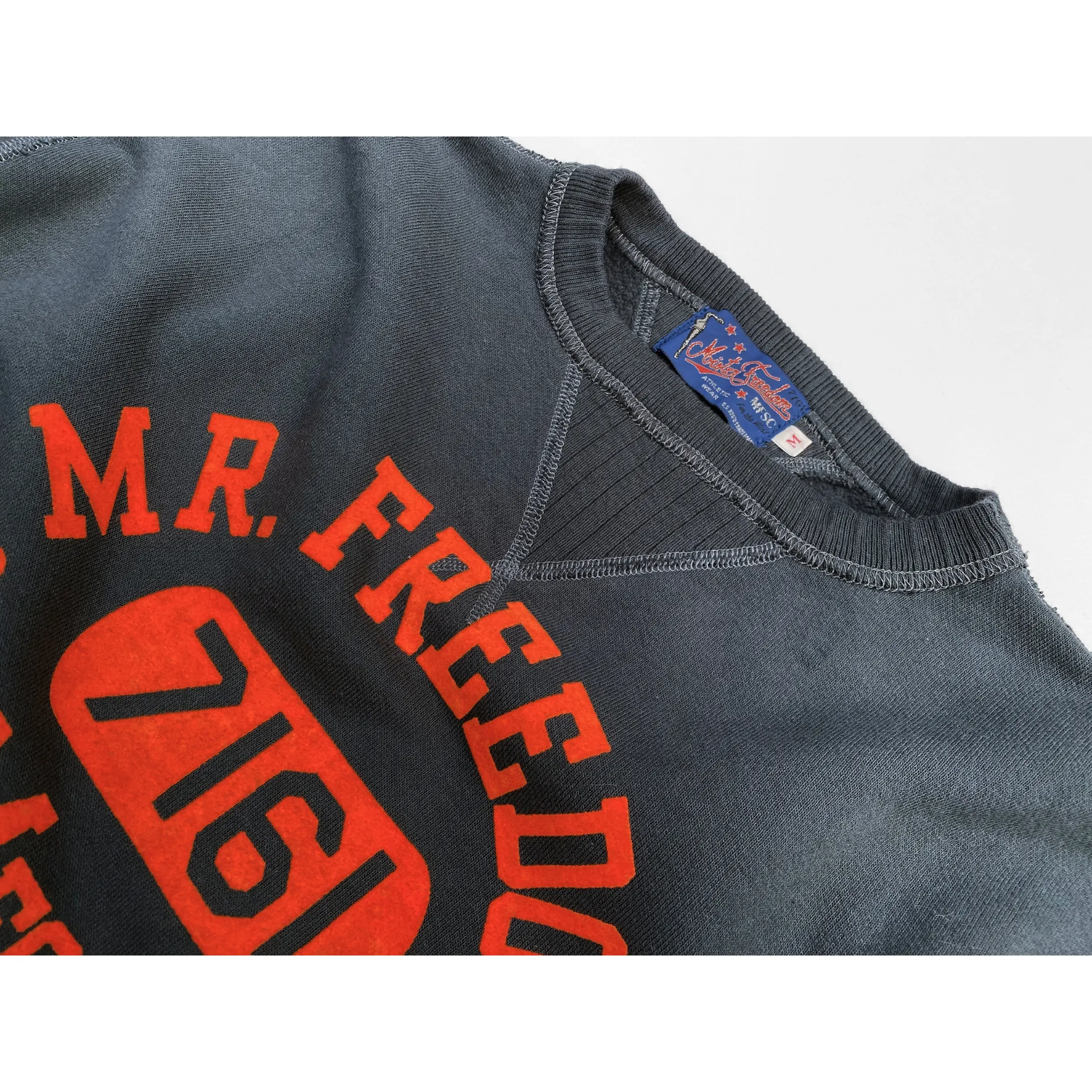 The Medalist Sweatshirt - Black "MfgCo." Flock Print